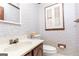 Quaint powder room with a stylish sink and charming wallpaper at 1502 Campground, Mcdonough, GA 30252