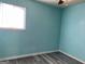 This bedroom features modern flooring and bright teal walls at 266 Ridge Trl, Riverdale, GA 30274