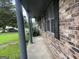 Covered porch with brick facade, providing a shaded entrance to the home at 266 Ridge Trl, Riverdale, GA 30274
