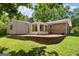 Exterior backyard and patio area with raised landscaping and brick pavers at 2826 Summit Ridge Dr, Marietta, GA 30066