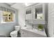 Vintage bathroom with retro tiles, a window, and a classic vanity, showcasing charm and character at 2826 Summit Ridge Dr, Marietta, GA 30066