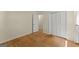 Bright bedroom with wood floors and closet with louvered doors at 2826 Summit Ridge Dr, Marietta, GA 30066