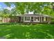 Charming brick home with a well-manicured lawn and inviting front porch at 2826 Summit Ridge Dr, Marietta, GA 30066