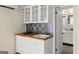 Close-up of a kitchenette with modern cabinets, sink, and tiled backsplash, perfect for efficiency at 2826 Summit Ridge Dr, Marietta, GA 30066