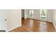 Sunlit living room with hardwood floors and large windows offering a view of the surrounding neighborhood at 2826 Summit Ridge Dr, Marietta, GA 30066