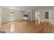 Bright living area featuring a kitchenette, hardwood floors, and windows providing natural light at 2826 Summit Ridge Dr, Marietta, GA 30066