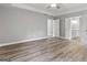Spacious bedroom with hardwood flooring and an ensuite bathroom at 5341 Stewart Mill Rd, Douglasville, GA 30135