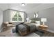 This bedroom features light gray walls, wood floors, and modern furniture at 5341 Stewart Mill Rd, Douglasville, GA 30135