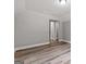 This bedroom features light gray walls, wood floors, a vaulted ceiling and neutral trim at 5341 Stewart Mill Rd, Douglasville, GA 30135