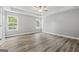 Bright bedroom with hardwood flooring, natural light, and plenty of space at 5341 Stewart Mill Rd, Douglasville, GA 30135