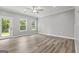 Bright bedroom with natural light, hardwood floors, and views of the backyard at 5341 Stewart Mill Rd, Douglasville, GA 30135