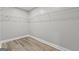 Empty walk-in closet featuring wood-style flooring and wire shelving at 5341 Stewart Mill Rd, Douglasville, GA 30135
