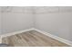 A simple closet with white shelving and neutral walls and floor at 5341 Stewart Mill Rd, Douglasville, GA 30135