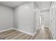 Neutral hallway with hardwood flooring with several rooms branching off at 5341 Stewart Mill Rd, Douglasville, GA 30135