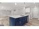 Kitchen island with a breakfast bar, cabinets, and a stainless steel dishwasher at 5341 Stewart Mill Rd, Douglasville, GA 30135