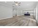 Open living space with wood-look vinyl plank flooring and a view of the kitchen at 5341 Stewart Mill Rd, Douglasville, GA 30135