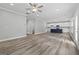 Spacious living room with hardwood floors and an open view of the kitchen and dining area at 5341 Stewart Mill Rd, Douglasville, GA 30135