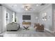 Comfortable living room with modern furnishings, a large television, and plenty of natural light at 5341 Stewart Mill Rd, Douglasville, GA 30135