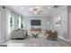 Bright living room featuring neutral colors, plush seating, and a view of the outdoors at 5341 Stewart Mill Rd, Douglasville, GA 30135