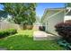Well maintained backyard featuring green lawn, concrete patio, and a wood fence for added privacy at 1283 Mercer, East Point, GA 30344