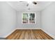 Bright bedroom featuring wood-look flooring, neutral walls, and a ceiling fan at 1283 Mercer, East Point, GA 30344