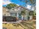 Charming bungalow-style home with a tidy front yard, updated paint, and a pop of color on the front door at 1283 Mercer, East Point, GA 30344