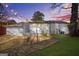 The backyard features a well-maintained lawn and an area covered with mulch, with string lights at 1092 Donnelly Sw Ave, Atlanta, GA 30310