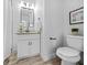 Modern bathroom with vanity, granite counters, toilet, and towel rack at 1092 Donnelly Sw Ave, Atlanta, GA 30310