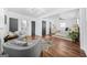 Spacious bedroom featuring hardwood floors, a sitting area, and ensuite bathroom access at 1092 Donnelly Sw Ave, Atlanta, GA 30310