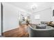 Open bedroom featuring hardwood floors, neutral decor, and a comfortable sitting area at 1092 Donnelly Sw Ave, Atlanta, GA 30310