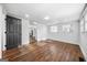 Bedroom with hardwood floors, natural light, and a black paneled door at 1092 Donnelly Sw Ave, Atlanta, GA 30310