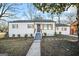 Charming single-story home with new exterior paint, dark roof and shutters, and a manicured lawn at 1092 Donnelly Sw Ave, Atlanta, GA 30310