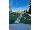 Well-manicured backyard featuring an elegant stepped stone pathway leading to a lush garden and privacy fence at 2410 Thrasher Rd, Buford, GA 30519