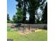 Backyard chicken coop and garden area featuring a garden, plants, and a secure fence at 2410 Thrasher Rd, Buford, GA 30519