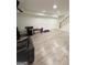 Spacious finished basement area showcasing the stairwell and gym equipment at 2410 Thrasher Rd, Buford, GA 30519