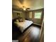 Bedroom with hardwood floors, a ceiling fan, and natural light from the window at 2410 Thrasher Rd, Buford, GA 30519