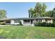 Charming home with a well-manicured lawn and an inviting covered porch, perfect for enjoying the outdoors at 2410 Thrasher Rd, Buford, GA 30519