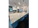 Spacious kitchen island with stone countertops and modern lighting at 2410 Thrasher Rd, Buford, GA 30519