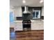 Well-equipped kitchen with stainless steel appliances and ample cabinet space at 2410 Thrasher Rd, Buford, GA 30519