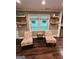 Cozy living room with natural light and stylish seating area at 2410 Thrasher Rd, Buford, GA 30519