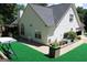Well-maintained backyard with a patio, various plants, and lush green turf at 25 Castlehill Ct, Covington, GA 30016