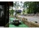 Inviting backyard with patio seating, lush greenery, and a view of the main house at 25 Castlehill Ct, Covington, GA 30016