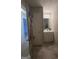 Bathroom vanity with storage and a mirror at 25 Castlehill Ct, Covington, GA 30016
