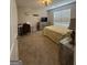 A comfortable bedroom has neutral tones and a dedicated desk space for work or study at 25 Castlehill Ct, Covington, GA 30016