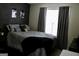 Cozy bedroom with a plush bed, window, and modern decor accents at 25 Castlehill Ct, Covington, GA 30016