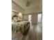 Comfortable bedroom featuring a tray ceiling, neutral tones, and sleek flooring at 25 Castlehill Ct, Covington, GA 30016