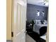 Stylishly decorated bedroom featuring a monochrome palette and modern wall art at 25 Castlehill Ct, Covington, GA 30016