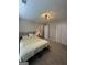 Carpeted bedroom with overhead lighting and a closet provides comfortable living space at 25 Castlehill Ct, Covington, GA 30016