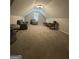 This large bonus room has neutral carpet and paint with a variety of seating options at 25 Castlehill Ct, Covington, GA 30016