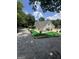 This home's backyard features artificial turf, a basketball hoop, and a deck with seating at 25 Castlehill Ct, Covington, GA 30016
